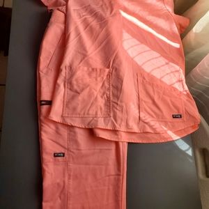 Bright highlighter pink Grey's Anatomy scrubs